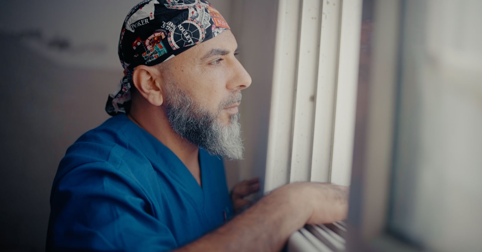 Obeid looking out of a window